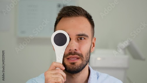 Patient checking eyesight at medical clinic photo