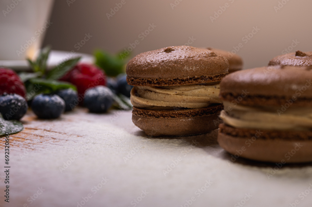 chocolate desserts on a light background close-up, with raspberries and blueberries. Christmas festive background chocolate desserts on a light background close-up, with raspberries and blueberries. Christmas festive background