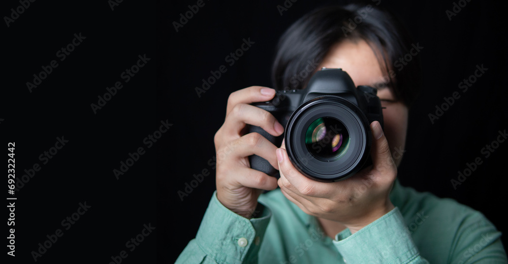 photographer take pictures Snapshot with camera. man hand holding with camera looking through lens.Concept for photographing articles Professionally photographer take pictures Snapshot with camera. man hand holding with camera looking through lens.Concept for photographing articles Professionally
