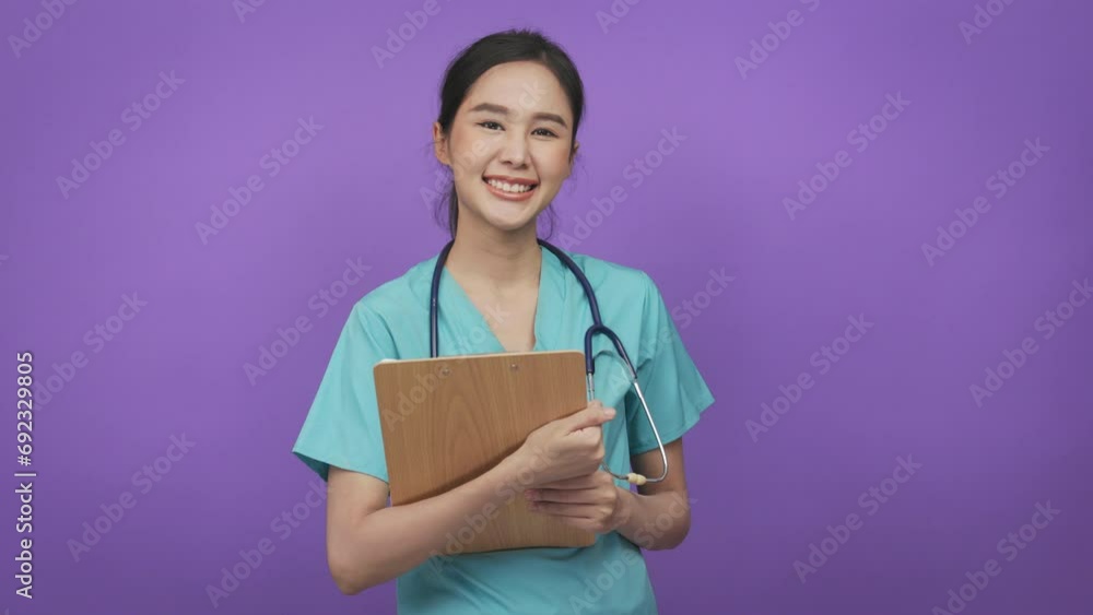 Young asian doctor surgeon happy smile indicate finger empty space advert advice isolated color background. Young asian doctor surgeon happy smile indicate finger empty space advert advice isolated color background.