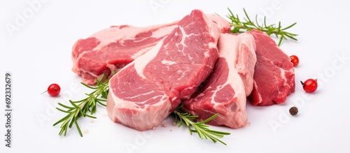Raw lamb or mutton fillet for cooking, along with cow meat steaks. photo