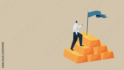 A man is trying to grab a flag on top of some gold nuggets.