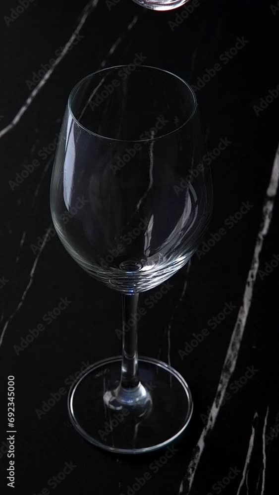 Pouring white wine in a wine glass
Pouring white wine in a wine glass