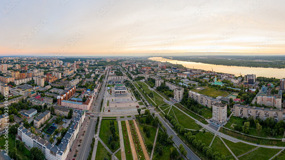Perm, Russia - August 3, 2020: Central part of the city of Perm. View of the Kama river. Panorama during sunset. Aerial view