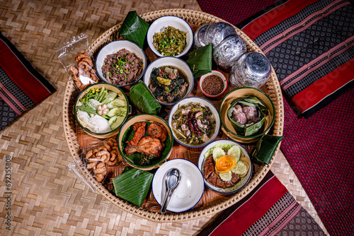 Khantoke, the traditional northern Thai style (Lanna) food with variety of delicious menus such as Nam-prig-Nhum (Green chili dip), local soup, Sai Aua (Thai spicy sausage), crispy pork skin