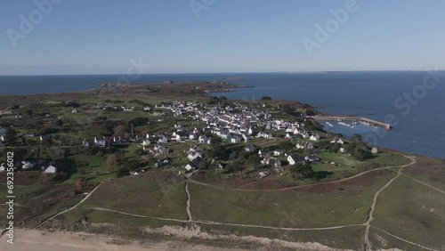 Island of Houat and town off the Bay of Quiberon on the Atlantic Brittany coast of France, Aerial dolly right shot photo