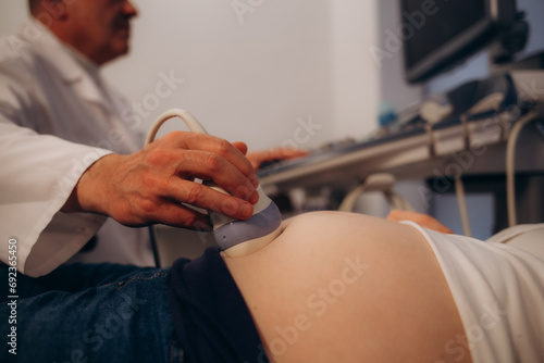 Cropped shot of a pregnant woman during ultrasound scanning at the fertility clinic copyspace device equipment sonogram examination healthcare pregnancy gynecology people professionalism trust photo