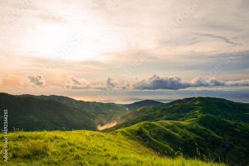 Fototapeta Naklejka Na Ścianę i Meble -  Landscape with mountains and blue sky at sunset. Cabaliwan Peak, Romblon, Philippines.