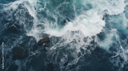 Churning sea waves crash in wild open ocean in this captivating aerial shot.	 photo