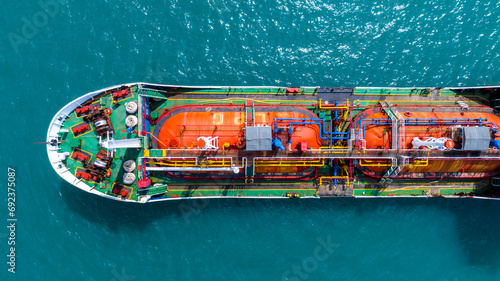 Aerial top view LPG gas ship, Ship tanker gas LPG top view on the sea for transportation, Liquefied Petroleum Gas tanker or LPG anchored in deep blue ocean sea. © Darunrat