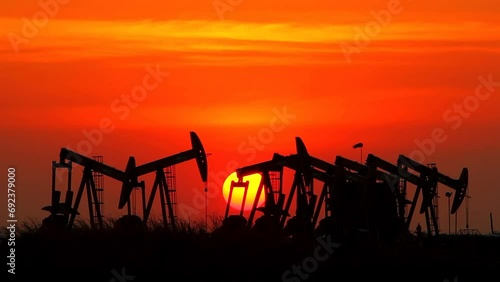 Sunset oil industry in the field at Thailand photo