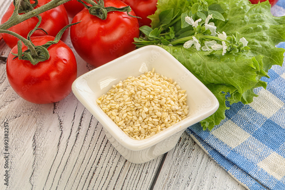Raw sesame seeds in the bowl Raw sesame seeds in the bowl