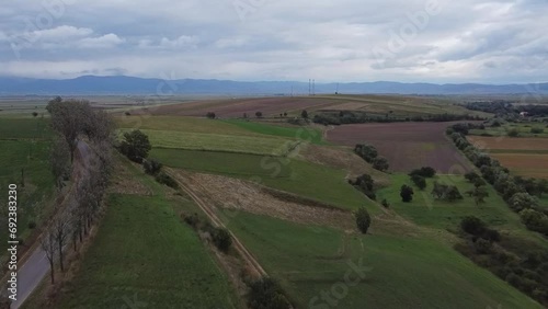 Aerial panoramic view of Romanian countryside with Carpathian line on the horizon photo