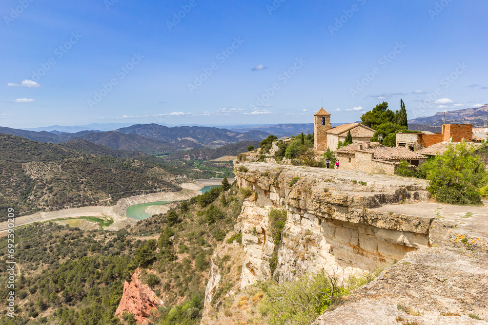 Historic Santa Maria church and surrounding mountains in Siurana, Spain