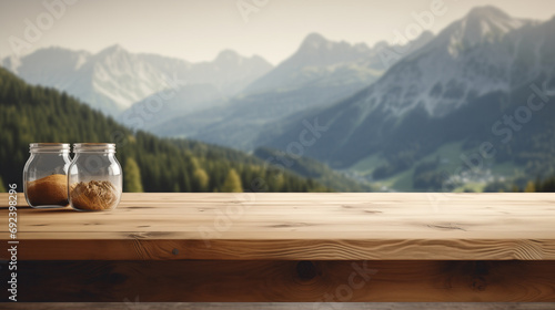 Empty wooden tabletop with tow jars on the table with blurred mountains background