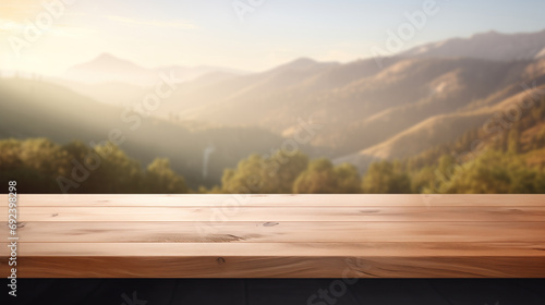 Empty wooden tabletop with nature blurred mountains background © Ryan