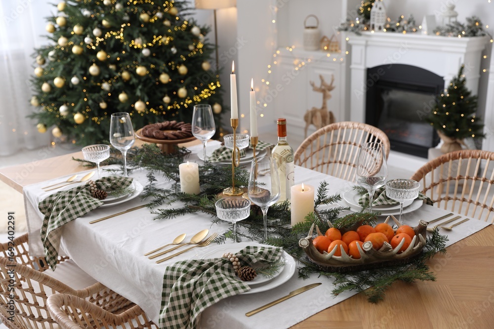 Fototapeta premium Christmas table setting with festive decor and dishware in living room