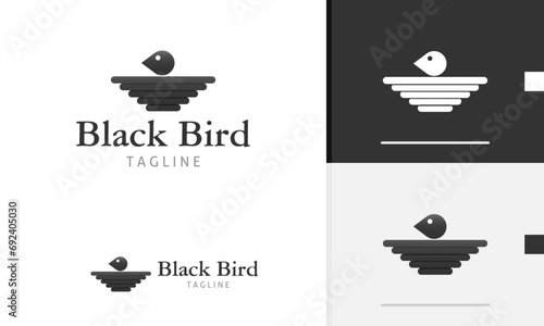 Logo design icon of geometric animal bird eagle crow head flat wing in black simple modern style