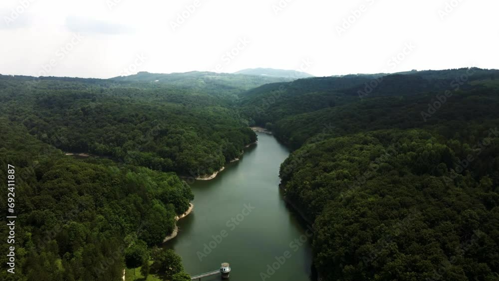 Drone flies over river surrounded by woods in mountain Bukulja, Serbia Drone flies over river surrounded by woods in mountain Bukulja, Serbia