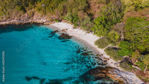 Koh Samet Island Thailand, aerial drone view from above at the Samed Island in Thailand with a turqouse colored ocean and a white tropical beach on a sunny day photo