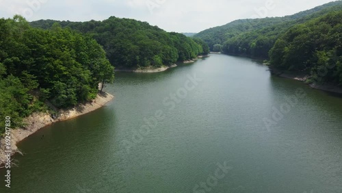 Drone flies above surface of a lake on mountain Bukulja, Serbia photo