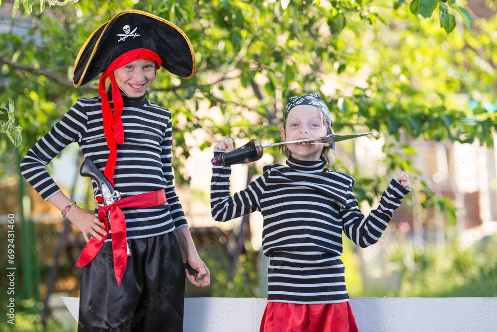 Fototapeta premium children play pirates at backyard