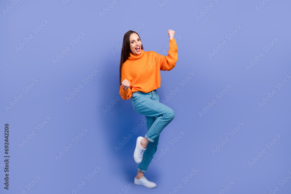 Full size photo of carefree champion in black friday lottery for aliexpress sale woman raised fists up isolated on purple color background Full size photo of carefree champion in black friday lottery for aliexpress sale woman raised fists up isolated on purple color background