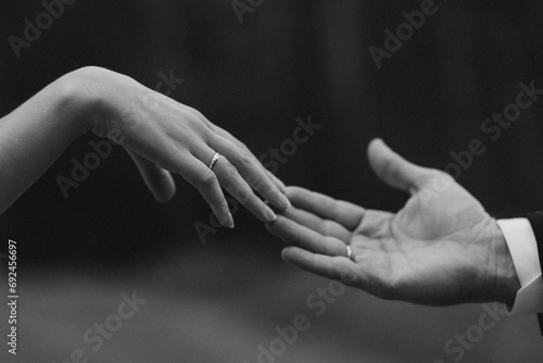 Hands of couple on their wedding day, female hand with engagement ring