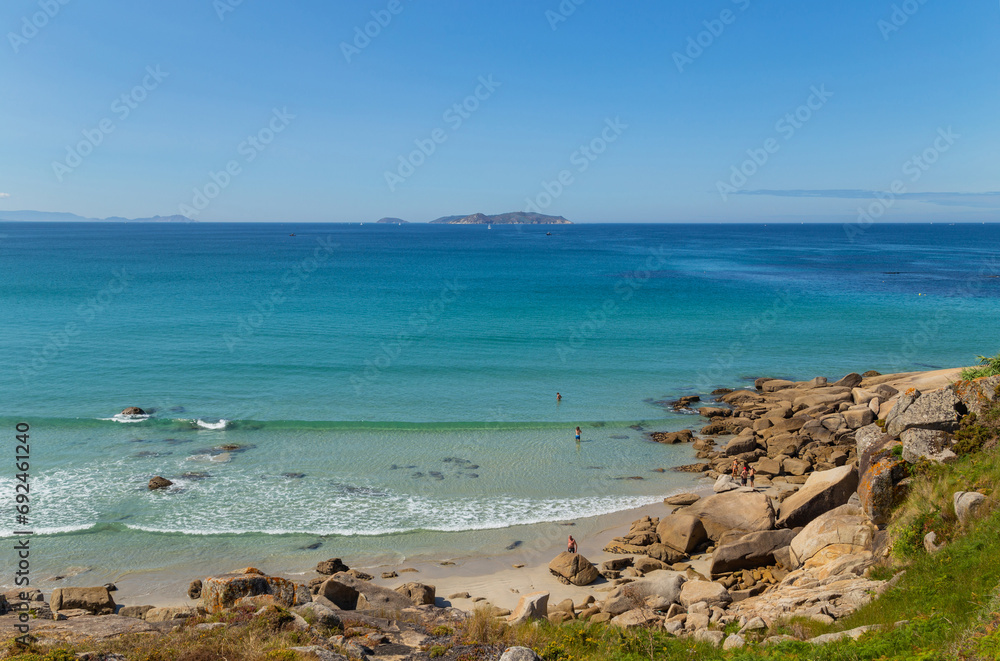 People in Galicia beach