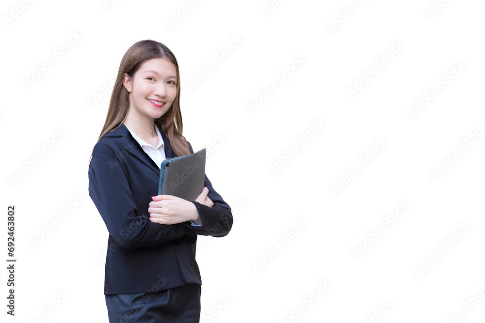 Professional young Asian business woman office worker in black suit smiles happily while she works and holds tablet while isolated on white background. Professional young Asian business woman office worker in black suit smiles happily while she works and holds tablet while isolated on white background.