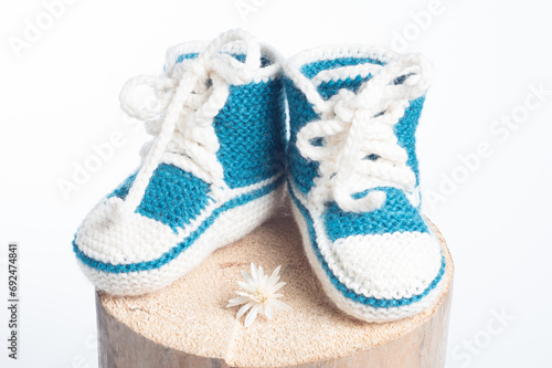 winter baby knitted woolen shoes isolated on white background