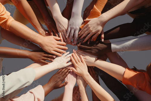 Diverse hands united together  forming a circle that symbolizes unity and teamwork