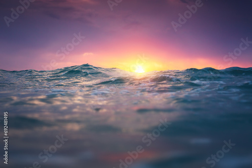 Sea wave close up, low angle view, sunrsie shot photo