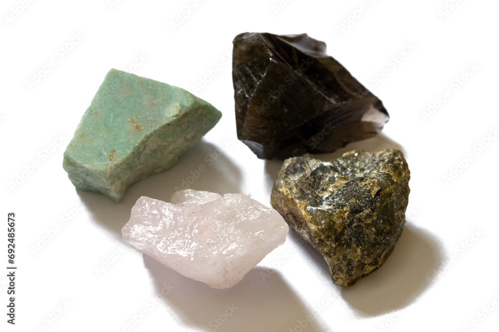 set of unpolished gemstones on white background set of unpolished gemstones on white background