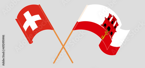 Crossed and waving flags of Switzerland and Gibraltar
