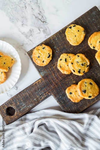 Italian style round shortbread cookies with black olives and Parmesan cheese