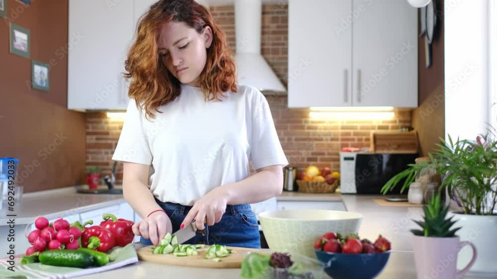 young caucasian woman make healthy food salads in home kitchen with vegetables and organic ingredients close-up background. Healthy breakfast. Vegan lifestyle young caucasian woman make healthy food salads in home kitchen with vegetables and organic ingredients close-up background. Healthy breakfast. Vegan lifestyle