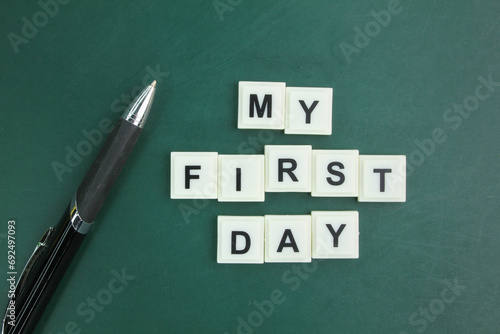 pen and alphabet letters with the word my first day. my first day concept. start day photo