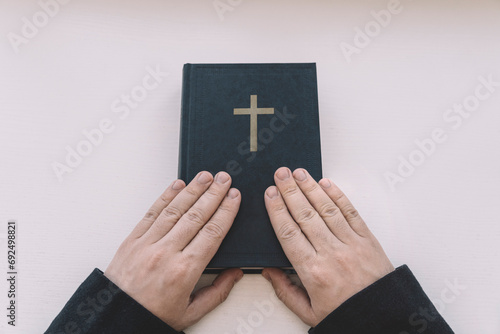 Holy Bible in men's hands. The concept of faith and religion. christian faith. top view photo