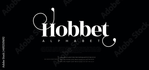 Hobbet premium luxury elegant alphabet letters and numbers. Elegant wedding typography classic serif font decorative vintage retro. Creative vector illustration photo