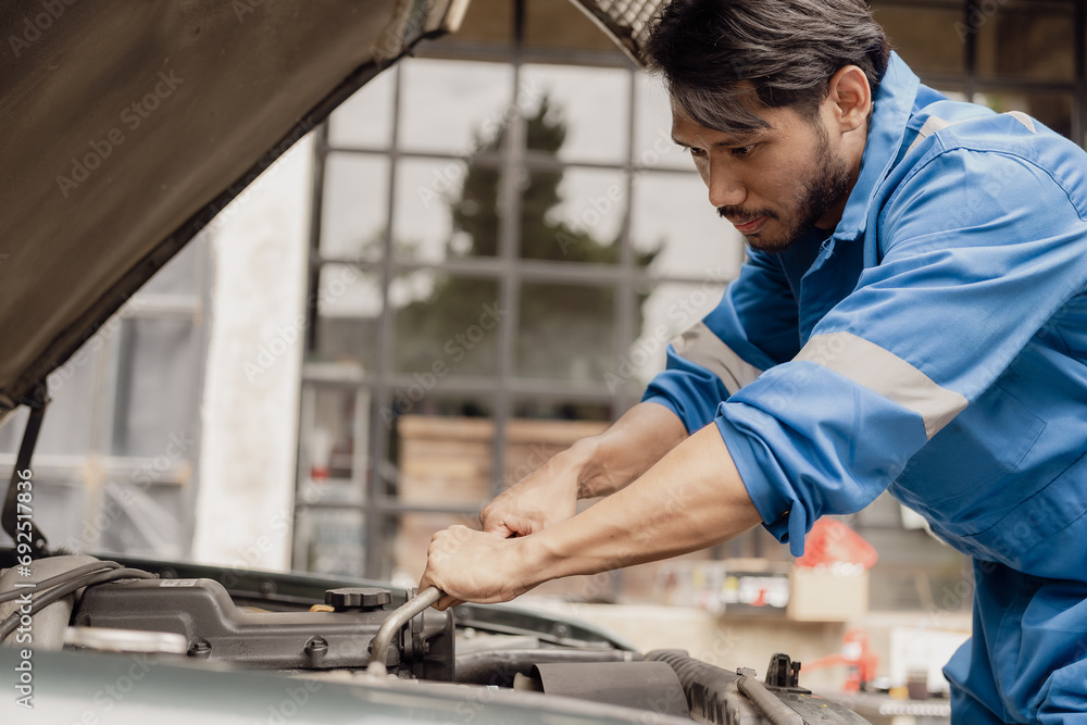Fototapeta premium car engine service concept Car mechanic checks car engine with car repair inspection, car service and maintenance, checks oil in car engine.