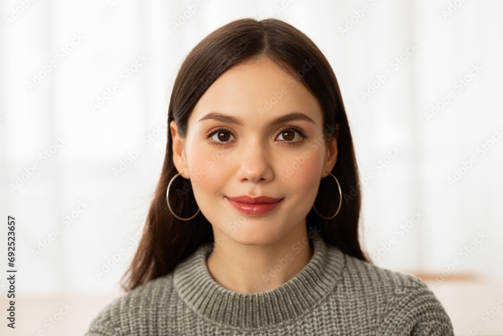 Closeup of cheerful brunette young woman posing at home Closeup of cheerful brunette young woman posing at home