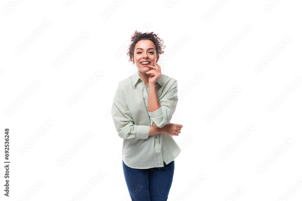 smiling young brunette curly woman dressed in a plaid shirt smiling young brunette curly woman dressed in a plaid shirt