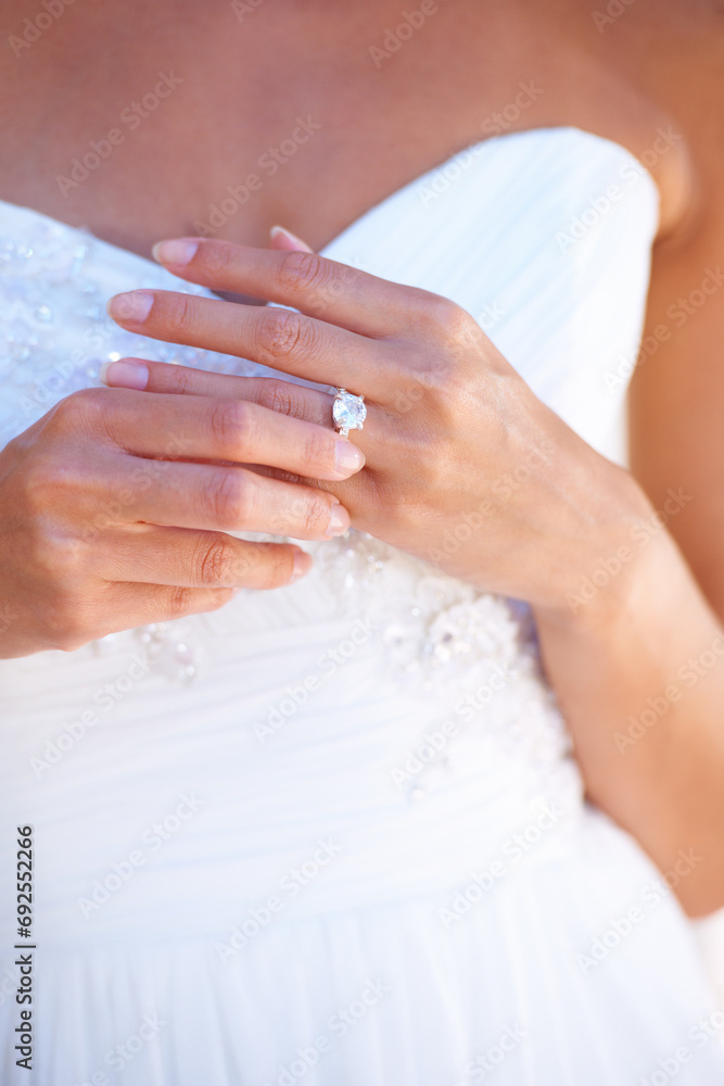 Bride, wedding ring and hand with diamond, jewellery and promise of commitment in marriage. Woman, closeup and aesthetic engagement jewelry with bridal gown, dress or fashion for ceremony with style