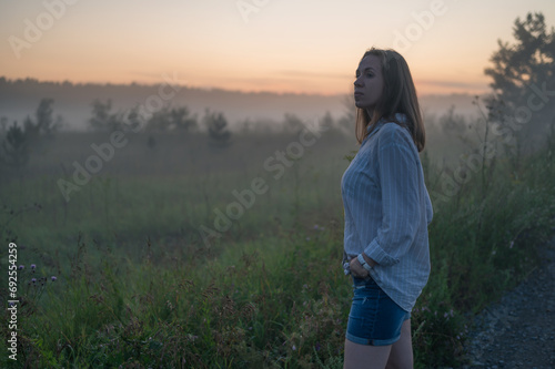 Woman in a field with fog