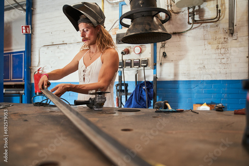 Fotografie Vigorous feminine joiner is labouring with concentration at his workplace