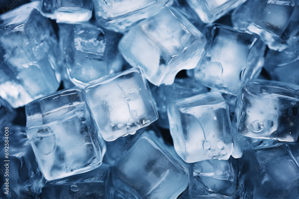 A pile of cool blue ice cubes over a black background A pile of cool blue ice cubes over a black background