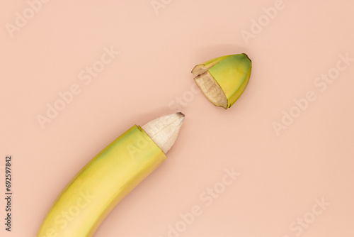Male circumcision concept, banana with skin cut off