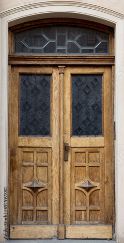 Old vintage wooden yellow door close-up