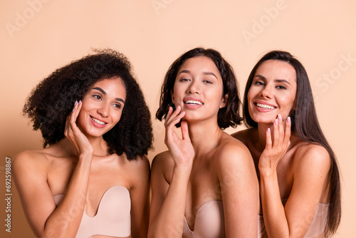 Studio photo of stunning gorgeous ladies dressed lingerie no filter skin doing care therapy isolated pastel beige color background